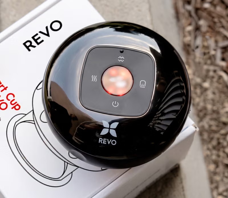 Close-up view of the Revo Smart Cup control panel and body