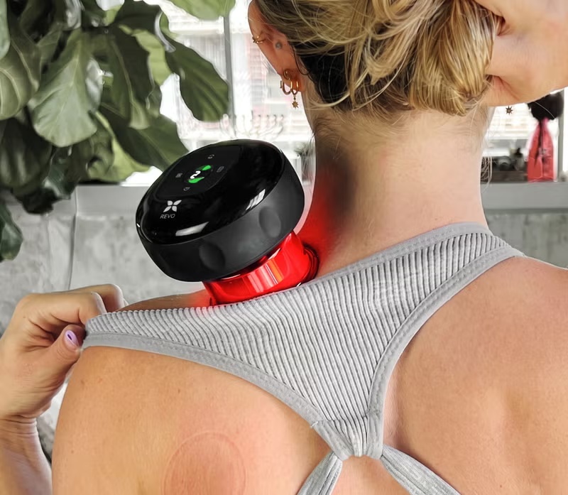 Revo-style cupping device being applied to skin